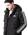 Man wearing a black adidas Combat Sports Winter Long Padded Parka Jacket.