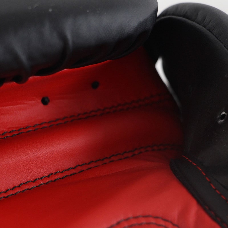 Close-up of a red and black boxing glove.