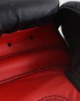 Close-up of a red and black boxing glove.