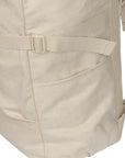 close up of tan backpack showing side pocket