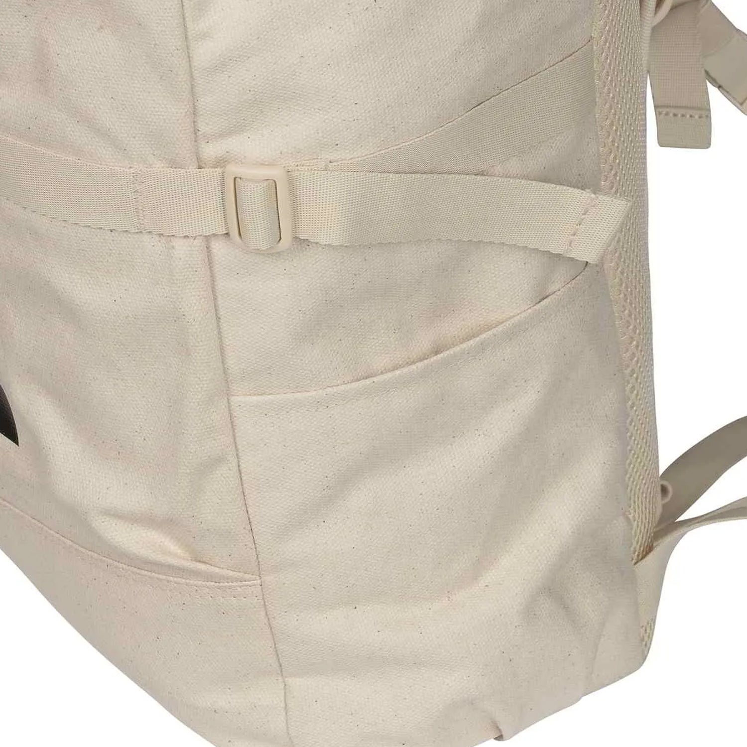 close up of tan backpack showing side pocket