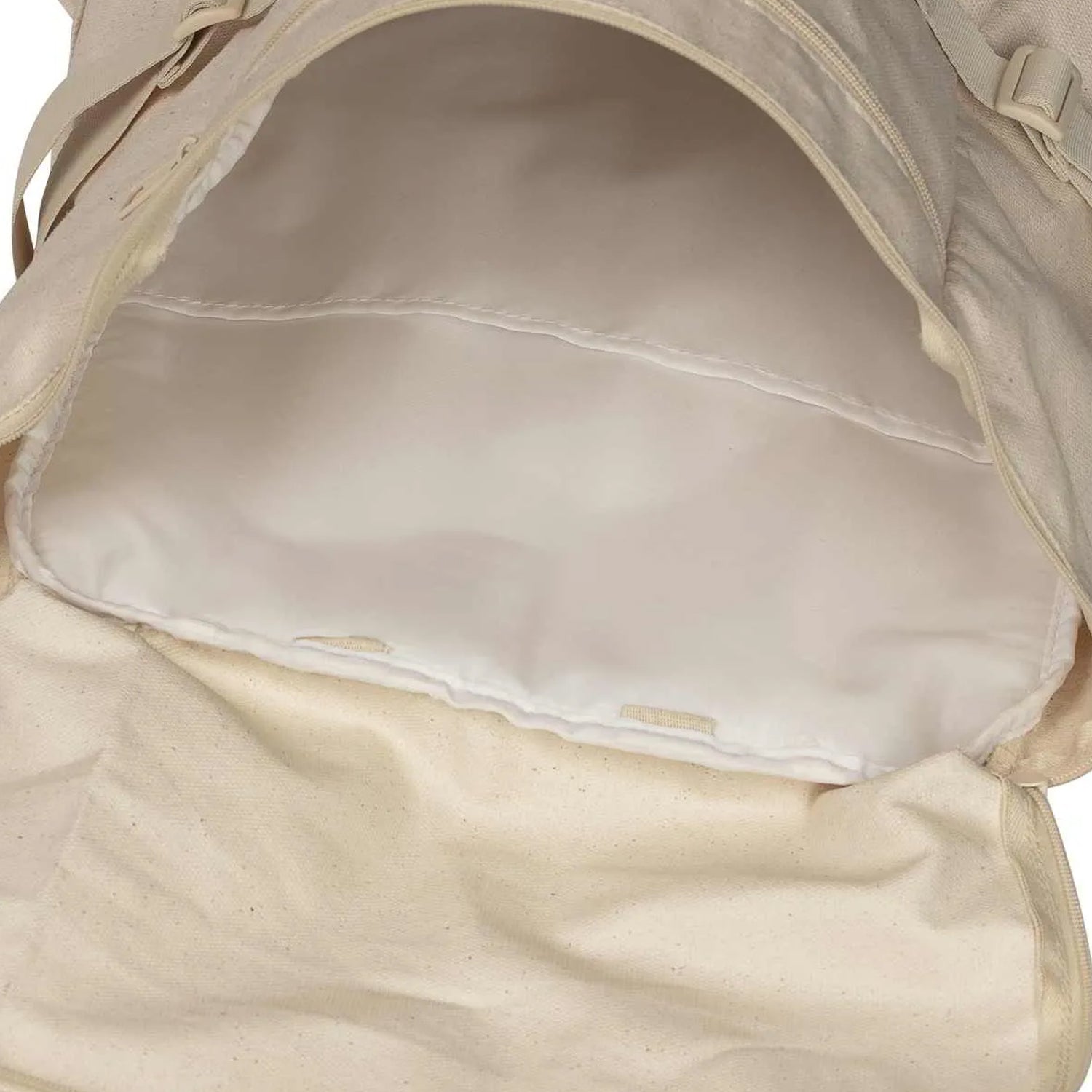 close up of tan backpack showing the inside, empty