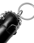 Close-up of Adidas key chain with a white logo.