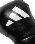Black boxing glove with white stripes.