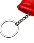 Close up of a red adidas glove keychain.