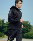Man running in a black jacket from adidas Men's Hydrosuit adiSS23.
