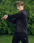 Man in a black jacket from adidas Men's Hydrosuit adiSS23.