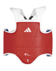 A reversible red and blue chest guard for taekwondo with white straps and the Adidas logo visible.