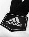 Black and white logo on a black belt with Adidas branding.