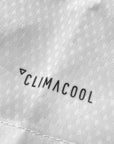 Close-up of fabric texture on Adidas taekwondo uniform.