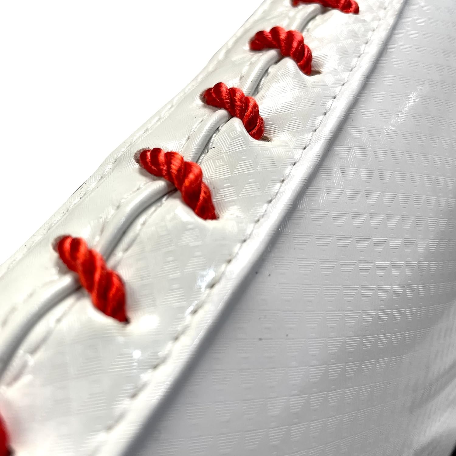 Close-up of a white baseball with red stitching on a white background