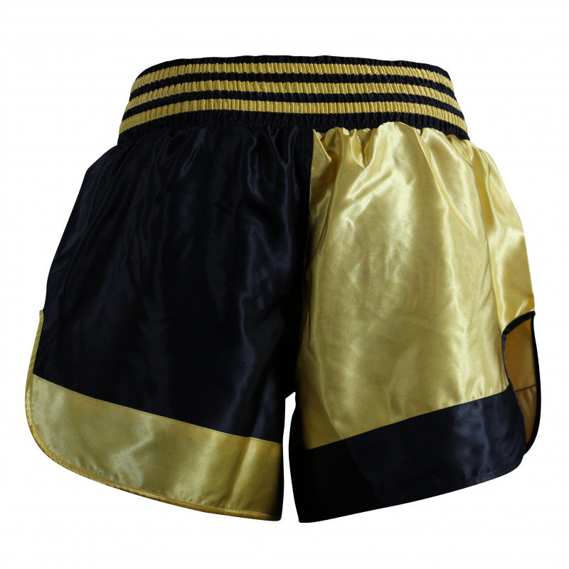 Black and gold Thai boxing shorts.
