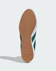 bottom of adidas sneaker, brown sole with engraved adidas logo