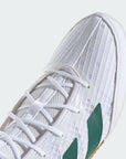 close up of toe box in white adidas sneaker, green logo faintly visible on side