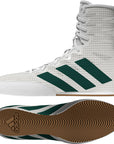 White boxing shoes with green stripes on a white background