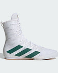 A pair of white and green boxing boots with lace-up closure and prominent green stripes on the side.