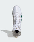 White high-top sneaker with green accents on a light gray background