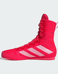 Red Adidas boxing shoe on a light gray background