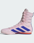 Pink Adidas boxing shoe with blue stripes on a light gray background