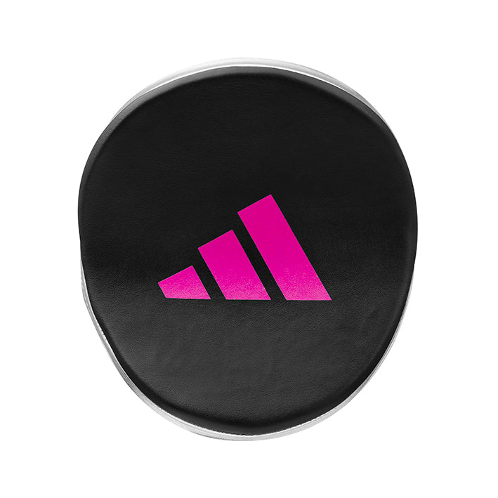 Black circular object with pink Adidas logo on a white background