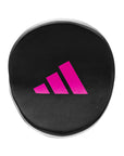 Black circular object with pink Adidas logo on a white background