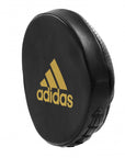 Black punching bag with yellow logo, boxing training.