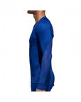 Man in blue shirt wearing adidas rashguard.