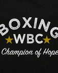 Black and white logo close-up on adidas WBC T-Shirt.