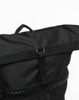 Black bag with zipper, adidas camo military sack bag close-up.