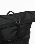 Black bag with zipper, adidas camo military sack bag close-up.