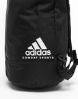 Close-up of black Adidas bag with white text and zipper.