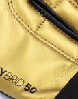 Close-up of black and gold boxing glove, adidas Hybrid 50.