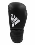Black adidas boxing glove with white logo.