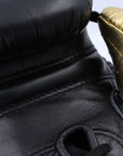 Close up of adidas Adi-Power Hybrid 500 Pro Boxing Glove in black and gold.