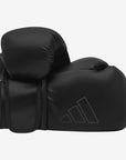 Black boxing glove on white background from Adidas Hybrid 80 series.