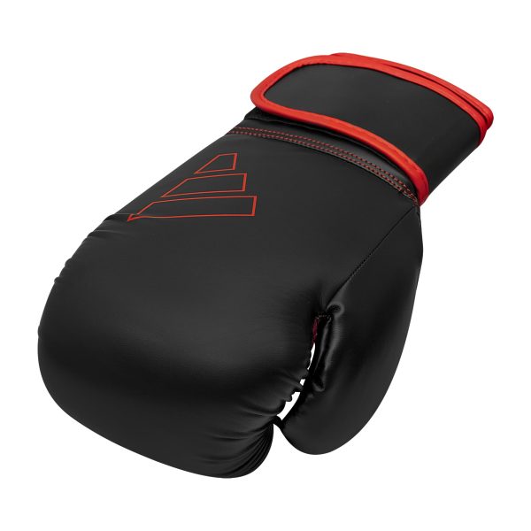 Black boxing glove with red trim, Adidas Hybrid 80, 10 oz.