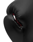 Close-up of Adidas Hybrid 80 boxing glove in black and red.