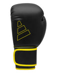 Black and yellow Adidas Hybrid 80 boxing glove.