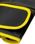 Black and yellow Adidas Hybrid 80 Training boxing glove close-up.