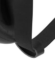 Close-up of a black strap on a product with a white background