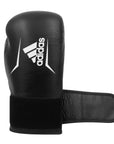 Black boxing glove with a white logo, adidas Speed 175.