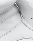 Close-up of white leather boxing glove.