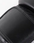 Close-up of a black adidas boxing glove.
