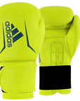 Yellow boxing gloves with Adidas logo on a white background