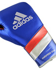 A blue boxing glove with red and white stripes from adidas Adi-Speed 500.