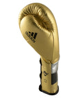 Gold boxing glove on a white background, Adidas Adi-Speed 500 model.