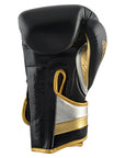Black and gold adidas boxing glove, 12 oz, for men and women.
