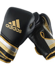 Pair of Adidas Adi-Speed 501 boxing gloves, metallic black, gold, silver, 14 oz.