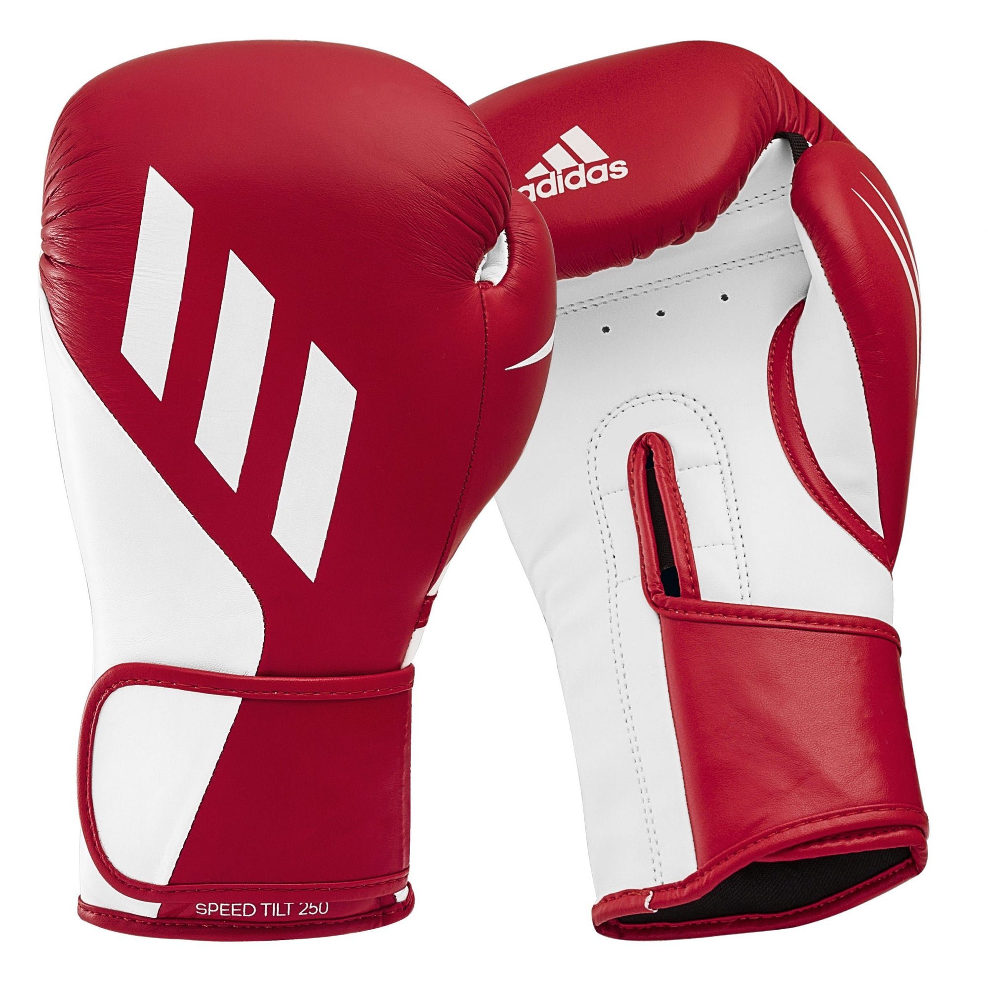 Pair of red and white boxing gloves for training.