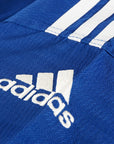 Close up of blue shirt from Adidas Champion Taekwondo uniform.